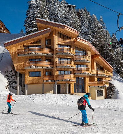 Exterior of snowy VIP SKI chalets in Avoriaz on sunny day