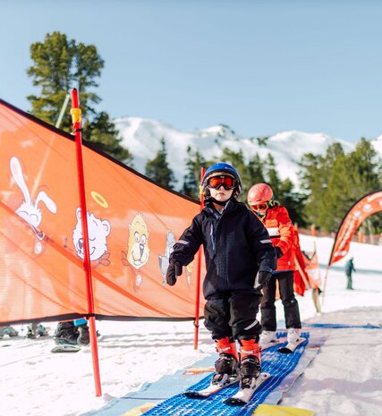Young skier in ESF beginner ski area in Arc 1950
