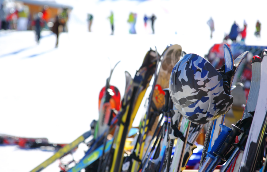 Skis and helmets outside mountain restaurant