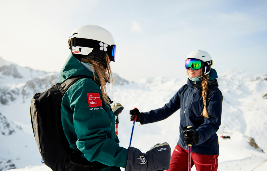 TDC ski instuctor talking to client