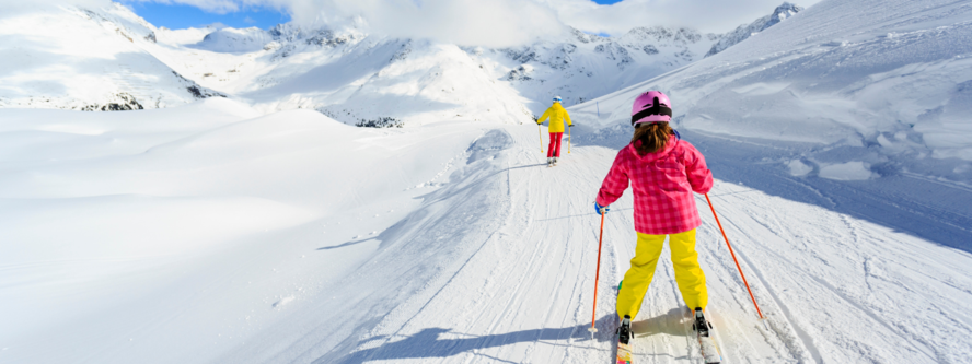 Mum and daughter skiing