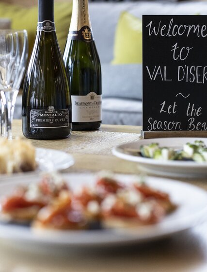 Champagne  and canapes on a chalet coffee table, No 1 Bellevarde, Val d'Isere