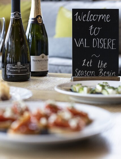 Champagne  and canapes on a chalet coffee table, No 1 Bellevarde, Val d'Isere
