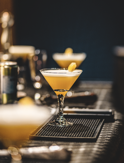 Yellow cocktail in a martini glass