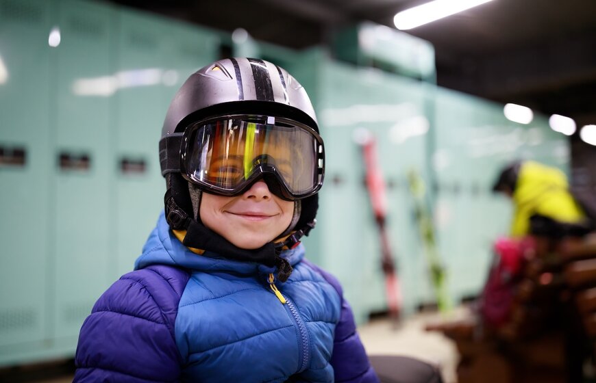 Smiling young boy wearing a ski helmet