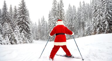 Father Christmas skiing