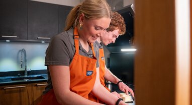 ski chalet hosts in kitchen