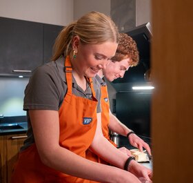 ski chalet hosts in kitchen