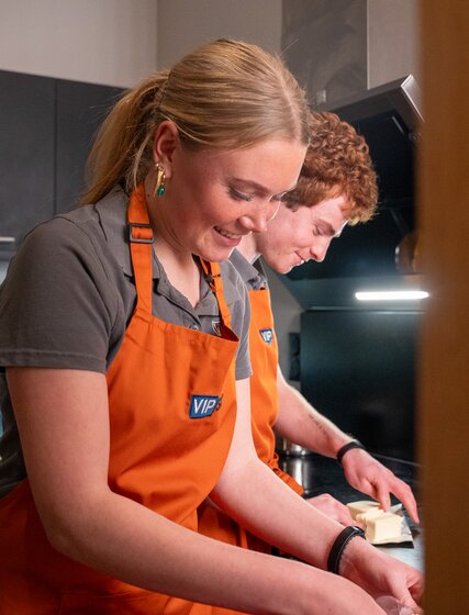 ski chalet hosts in kitchen
