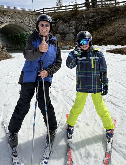 Grandpa and grandson skiing