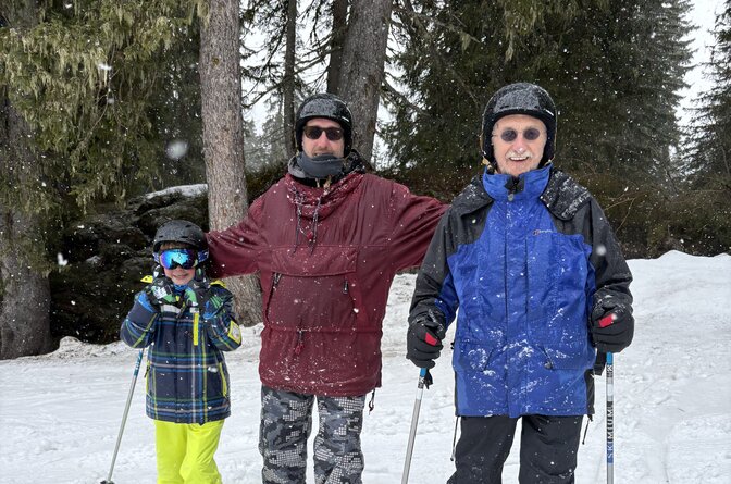 Three generations skiing