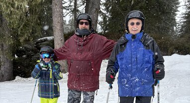 Three generations skiing