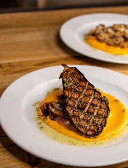 VIP SKI aubergine steak on bed of sweet potato puree and shallots
