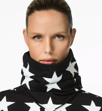 Woman wearing black neckwarmer with white stars on