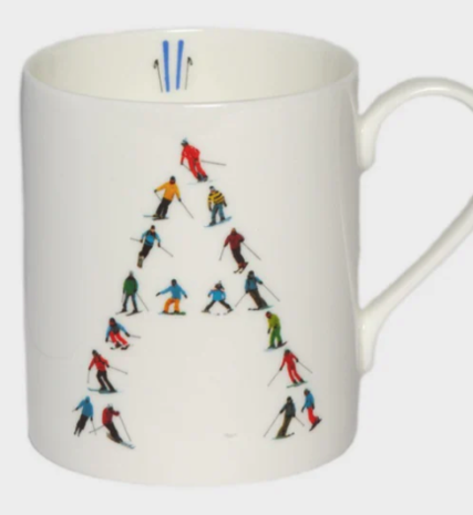 White mug with the letter A made up of skiers