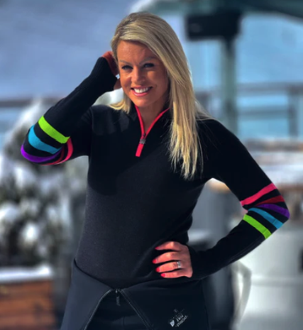 Skier Chemmy Alcott wearing navy rainbow stripe midlayer by Snow Finel