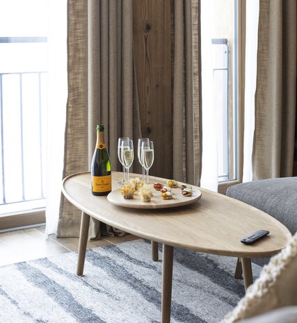 Welcome canapes and champagne on coffee table in Graciosa chalet