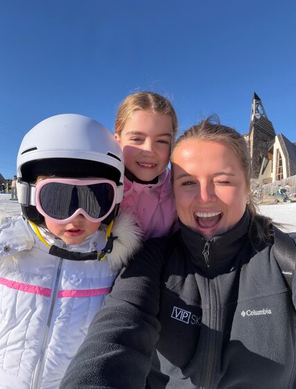 VIP SKI nanny smiling with two children
