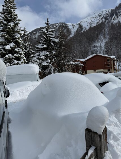 Car covered in deep snow in Val d'Isere February 2026