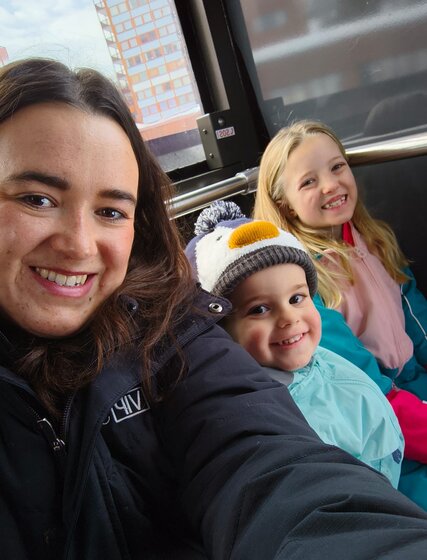 VIP SKI nanny smiling with two children