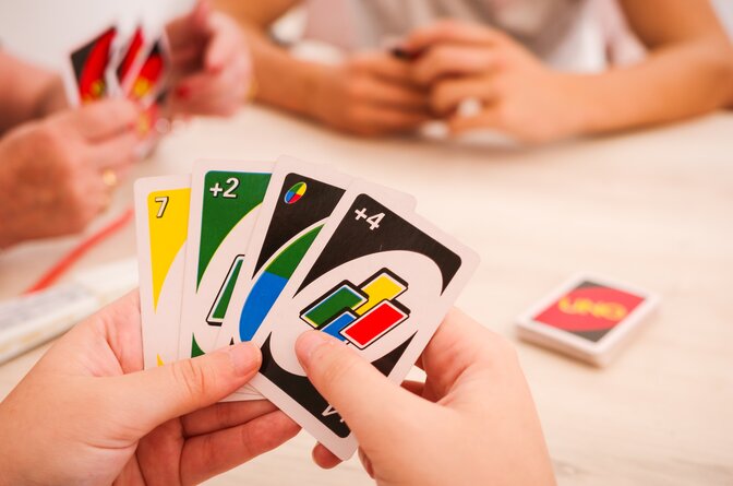Family playing UNO card game