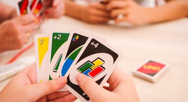 Family playing UNO card game