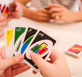 Family playing UNO card game