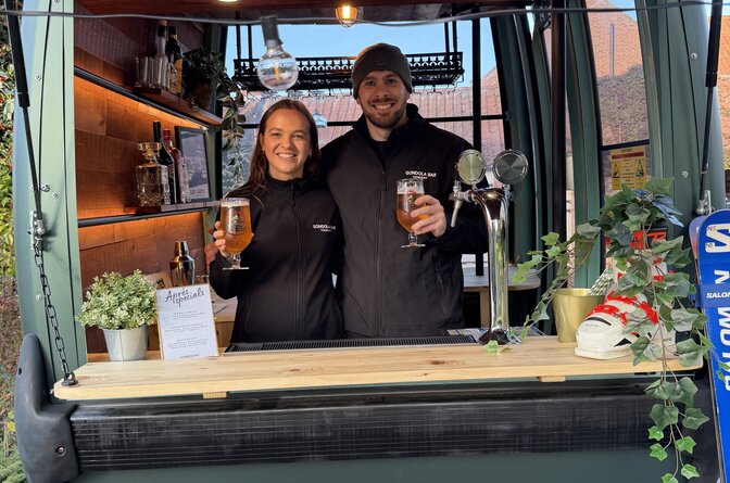 Smiling couple in converted gondola bar