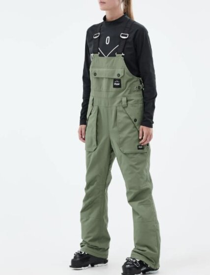 Woman wearing olive green bib snowboarding pants