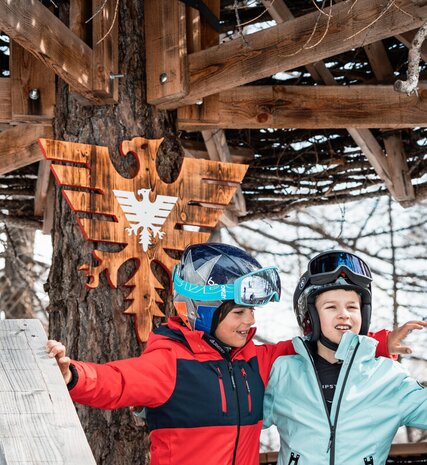 Two children in ski gear in the Village Perdu, Val d'Isere