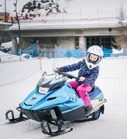 Young girl on electric skidoo