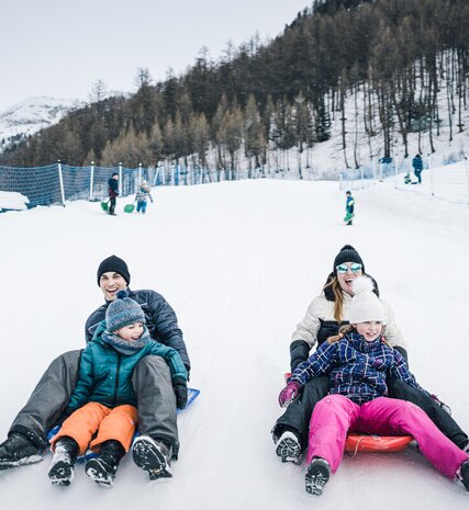 Family of four sledging