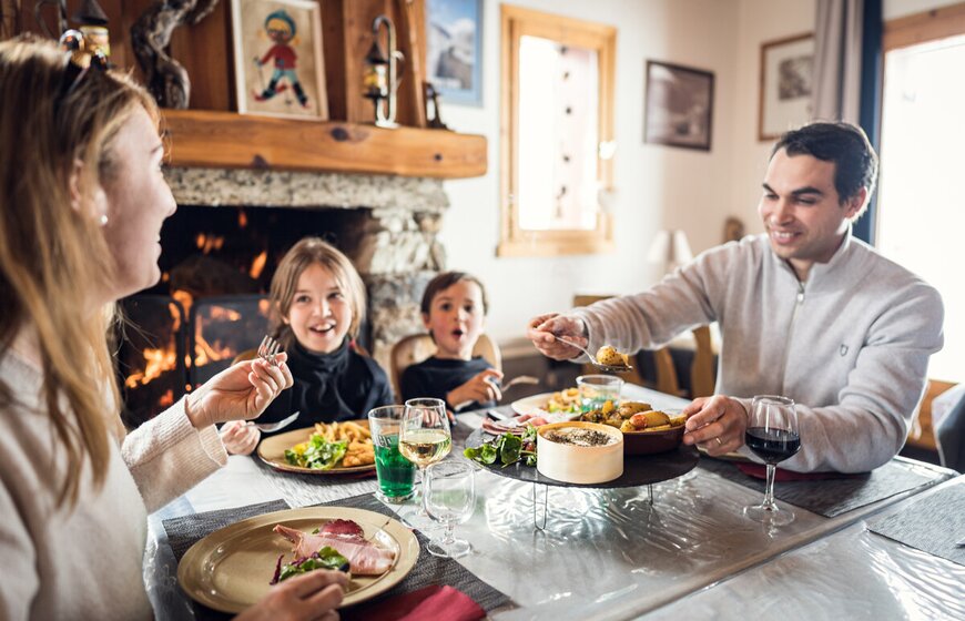 Family of four eating at the cosy Bout du Monde restaurant