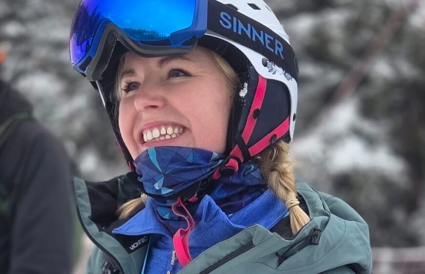 Smiling female skier