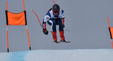 Skier Max Laughland getting air in GS race
