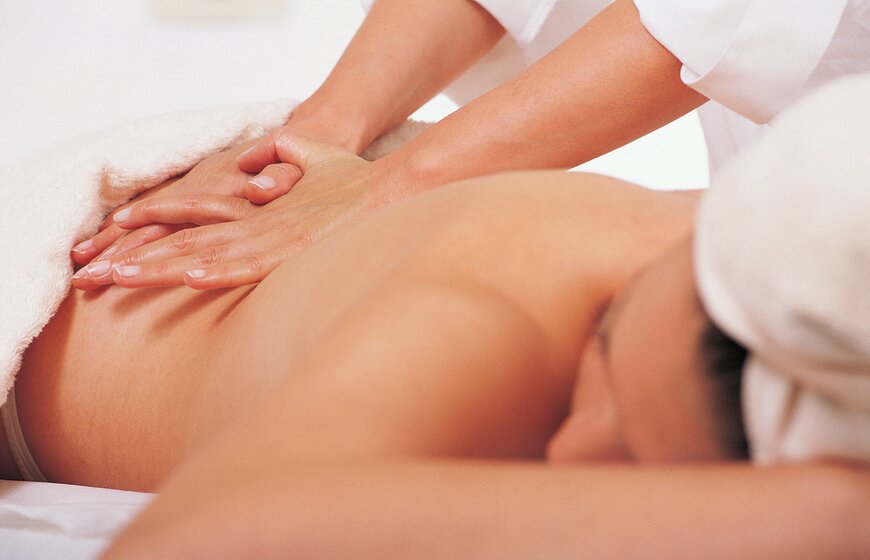 Woman having back massage