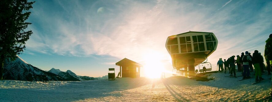 Ski lift in Morzine with skiers queuing 