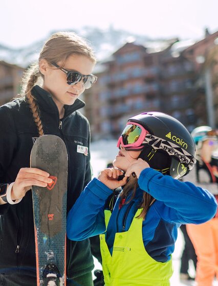 VIP SKI ski nanny with young girl getting ready for ski school in Les Arcs
